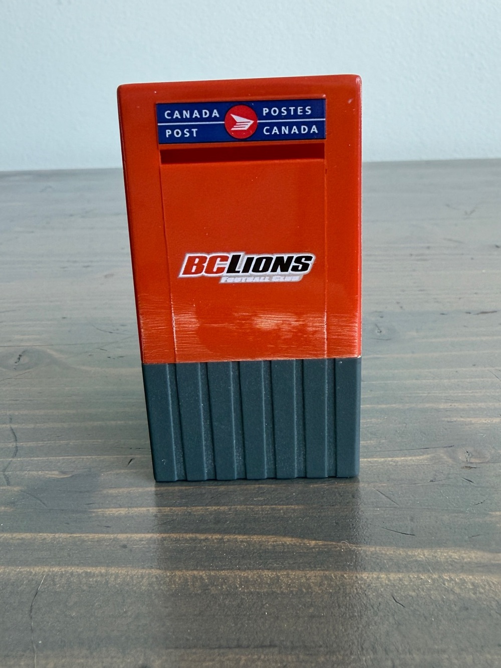 Vintage plastic Canada Post roll stamp dispenser 
BC Lions Football